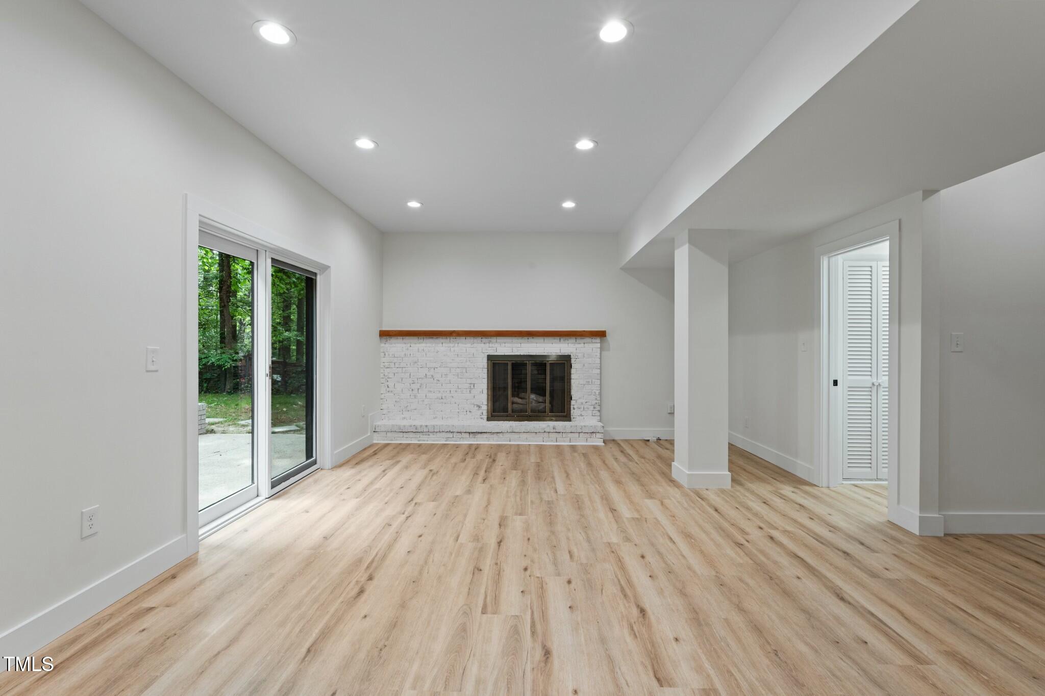 6421 Arrington Road Raleigh, NC 27607 - Photo 19 of 31 wooden floor in an empty room with a window