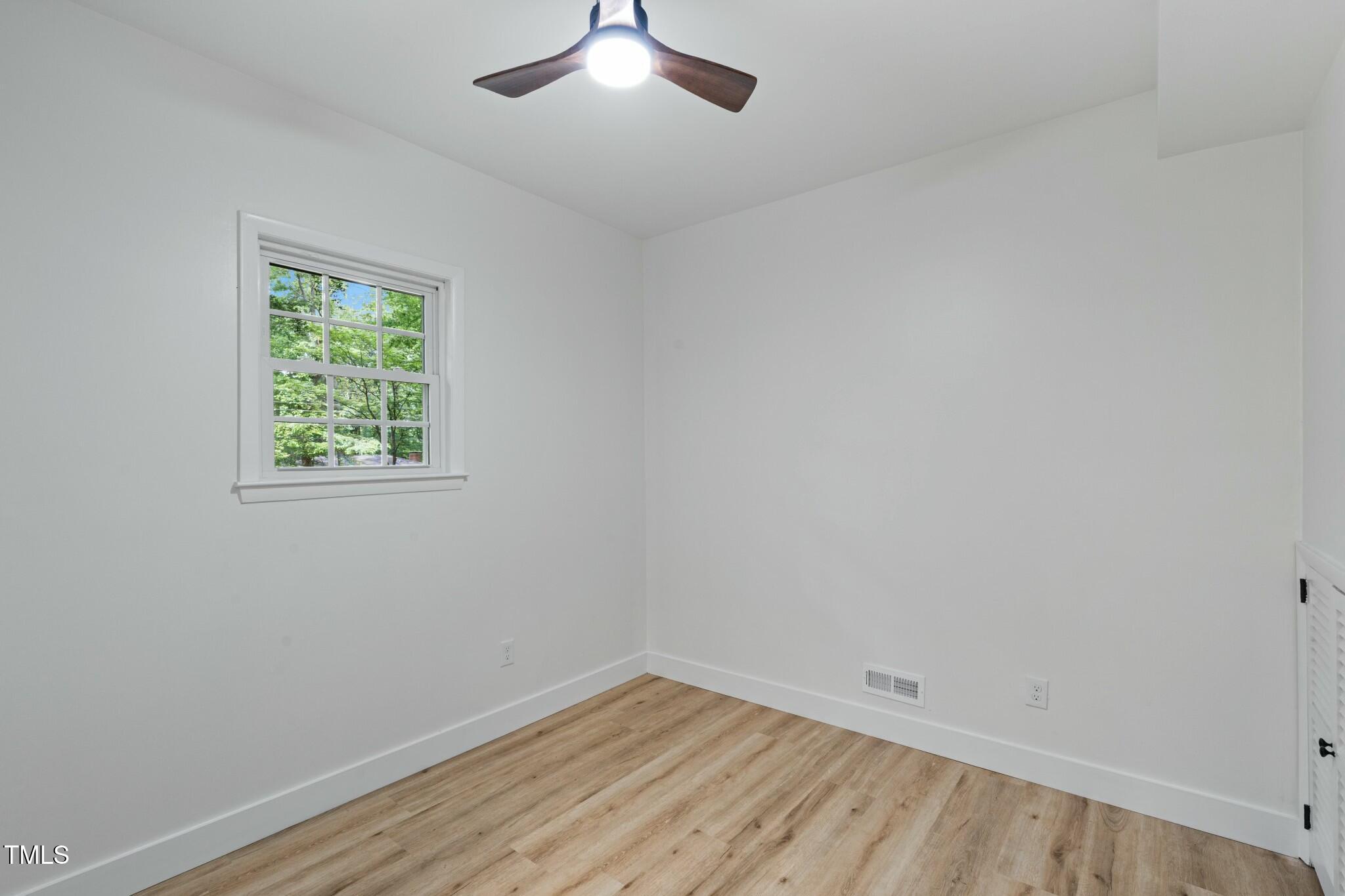 6421 Arrington Road Raleigh, NC 27607 - Photo 20 of 31 an empty room with a window