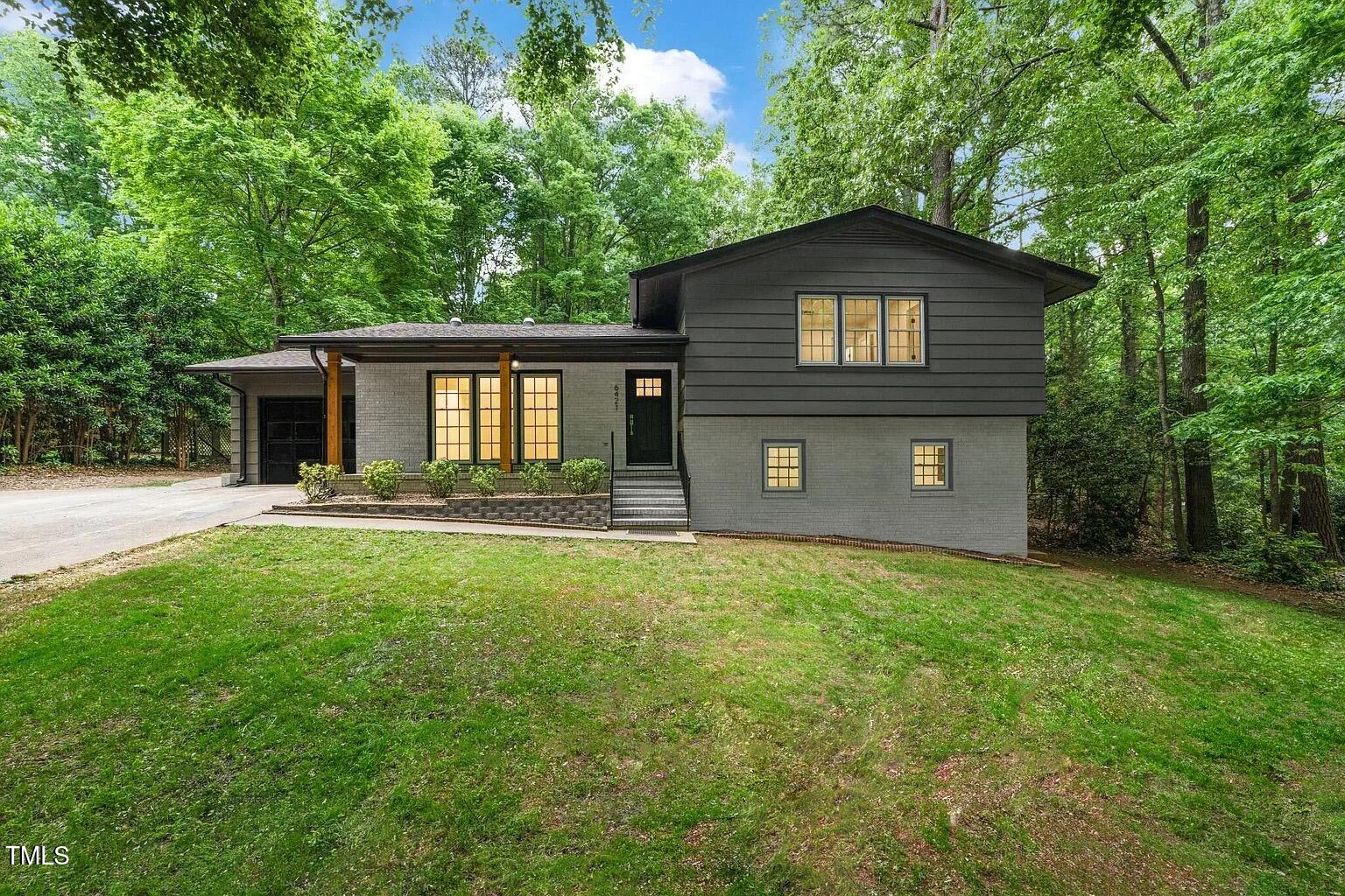 6421 Arrington Road Raleigh, NC 27607 - Photo 2 of 31 a front view of a house with yard and green space