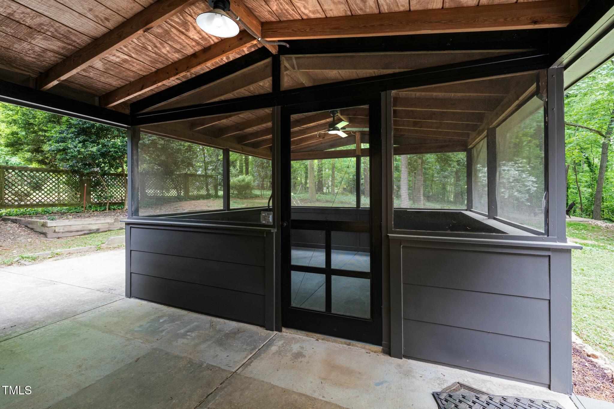 6421 Arrington Road Raleigh, NC 27607 - Photo 24 of 31 a bedroom with a bed and a large window