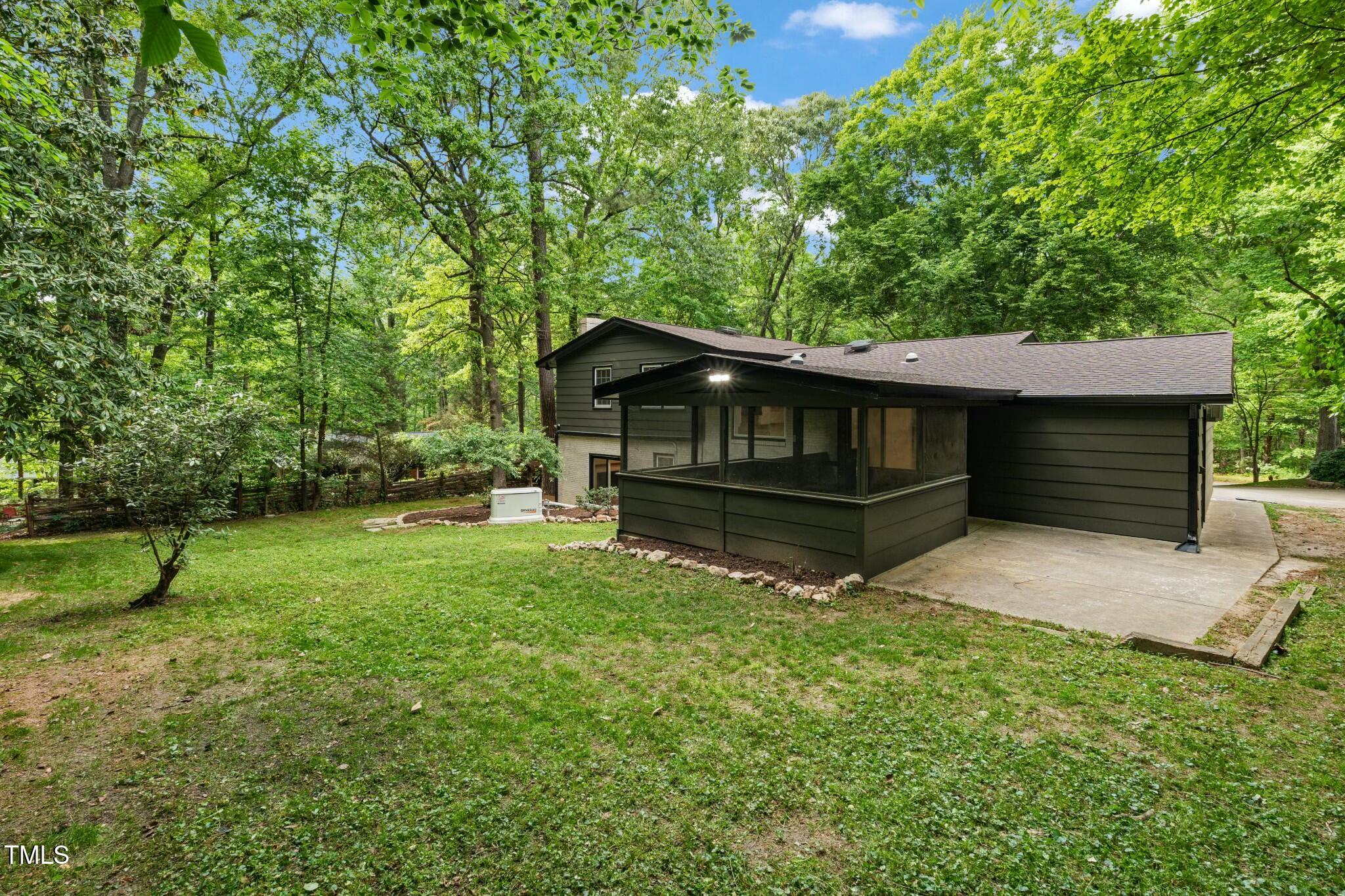 6421 Arrington Road Raleigh, NC 27607 - Photo 29 of 31 a view of backyard with a garden and entertaining space