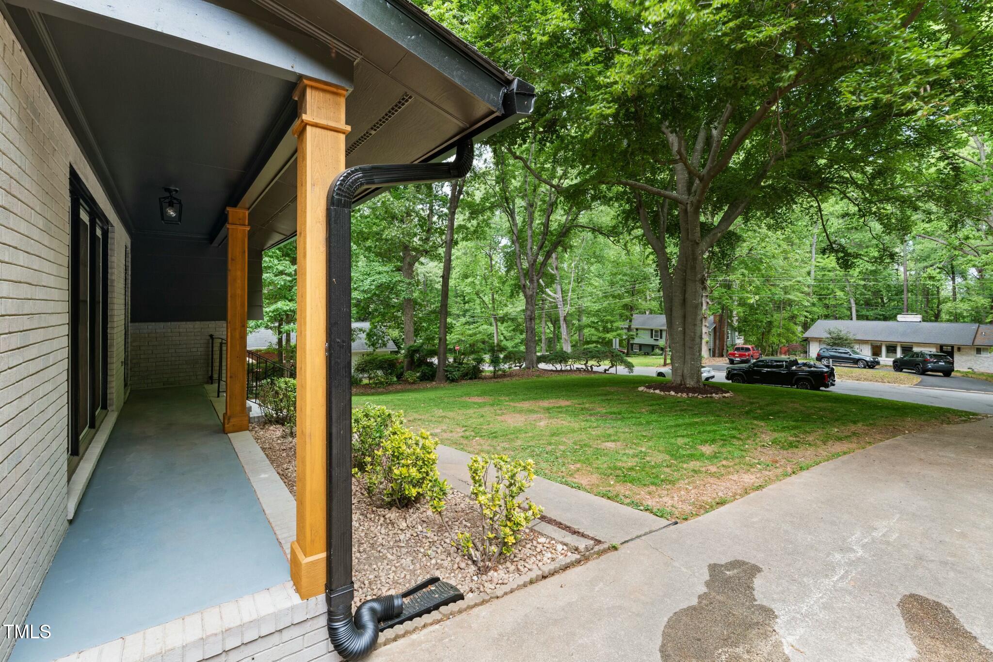 6421 Arrington Road Raleigh, NC 27607 - Photo 30 of 31 a view of a house with backyard and sitting area