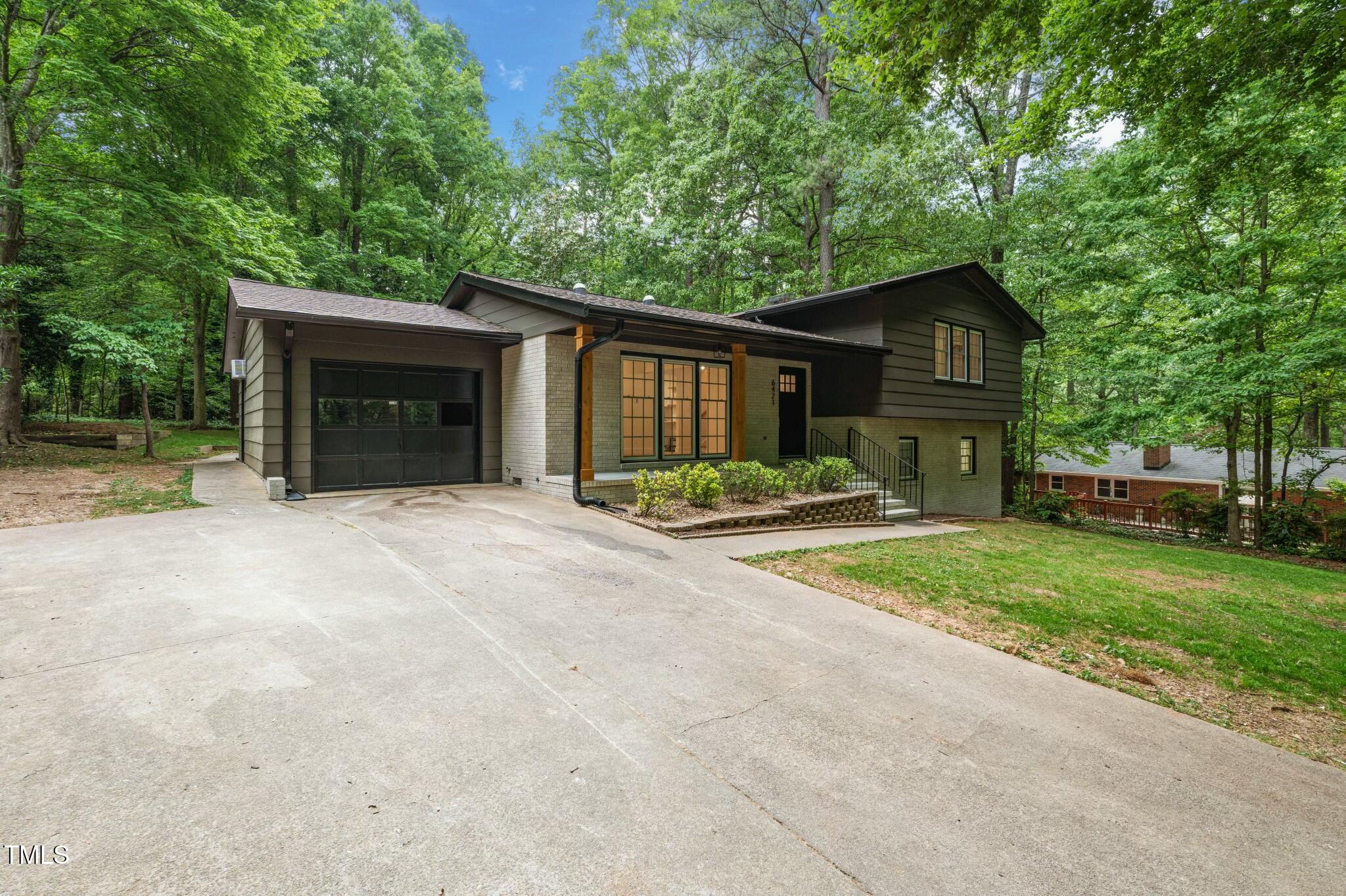 6421 Arrington Road Raleigh, NC 27607 - Photo 31 of 31 front view of a house with a yard