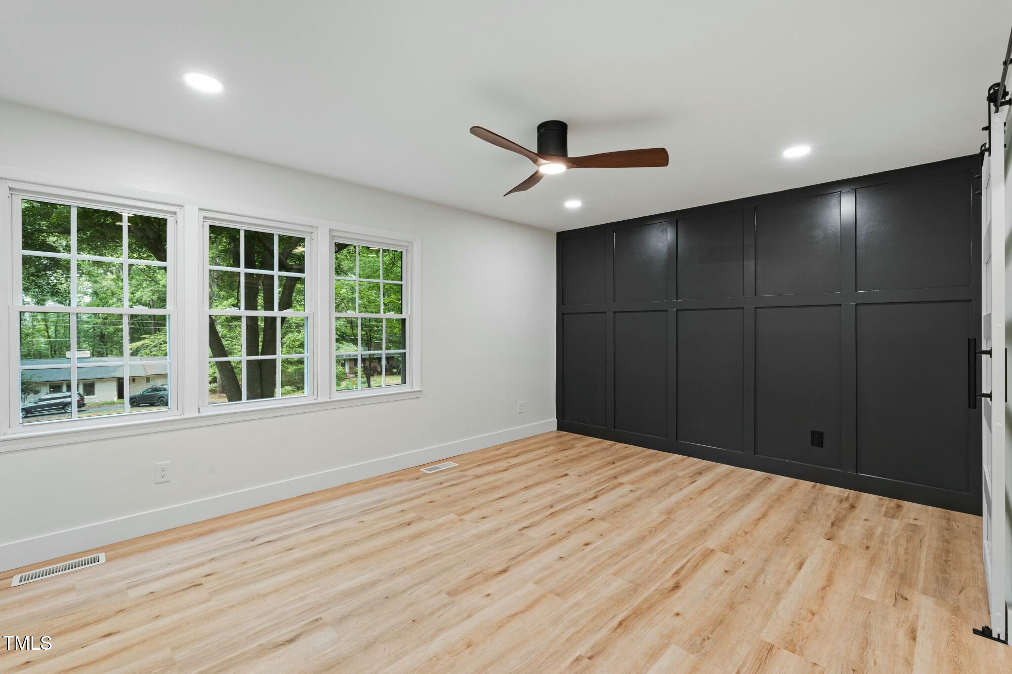 6421 Arrington Road Raleigh, NC 27607 - Photo 10 of 31 a view of an empty room with a window