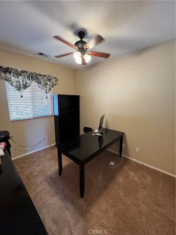 a view of a workspace with furniture