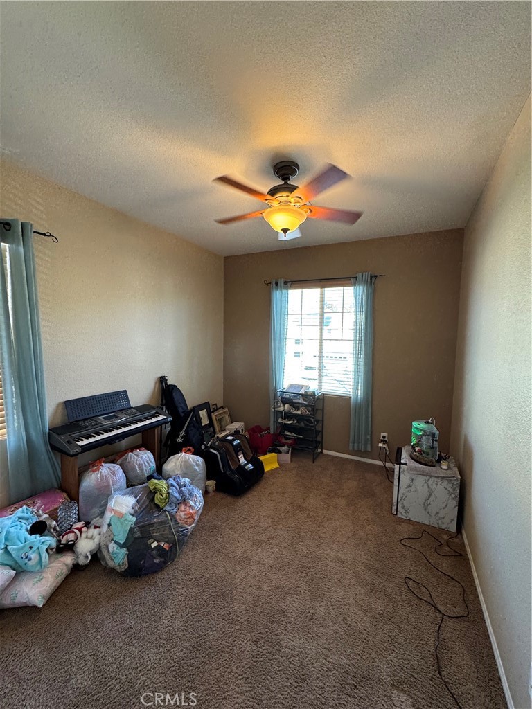 12203 Appian Drive Rancho Cucamonga, CA 91739 - Photo 16 of 20 a living room with furniture toys and a window