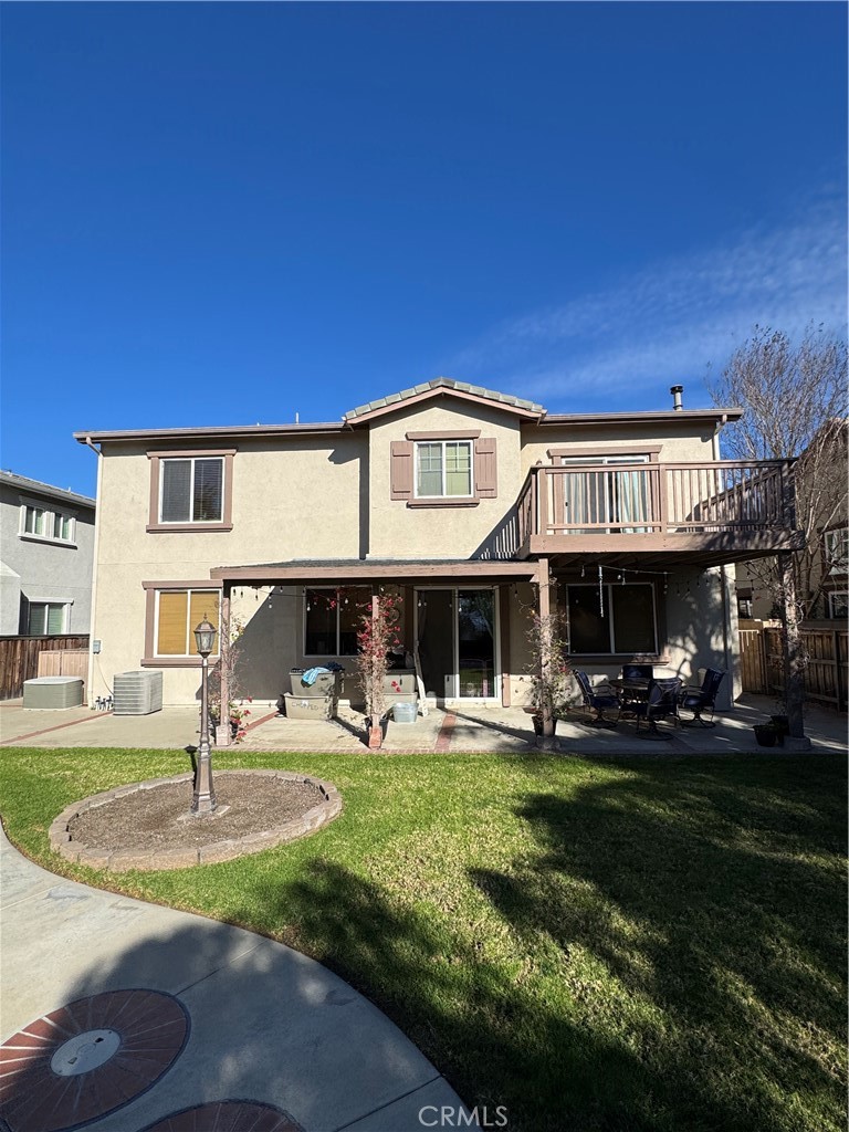 12203 Appian Drive Rancho Cucamonga, CA 91739 - Photo 20 of 20 a front view of a house with garden and sitting area