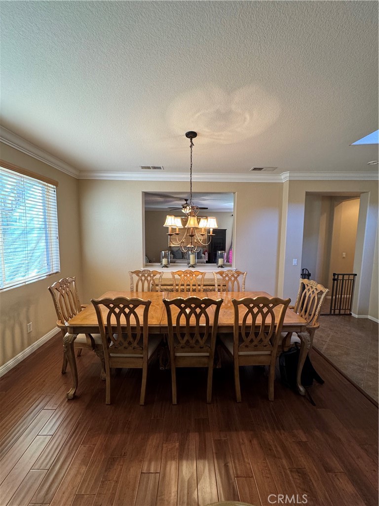 12203 Appian Drive Rancho Cucamonga, CA 91739 - Photo 6 of 20 a dining room with furniture window and wooden floor