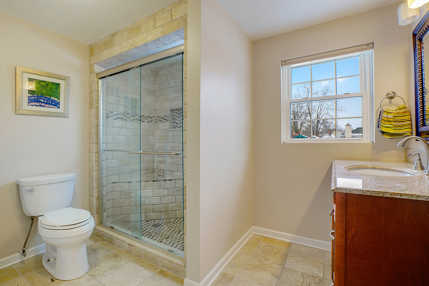 3220 Techny Road Northbrook, IL 60062 - Photo 19 of 37 a bathroom with a granite countertop toilet a sink a mirror and a shower