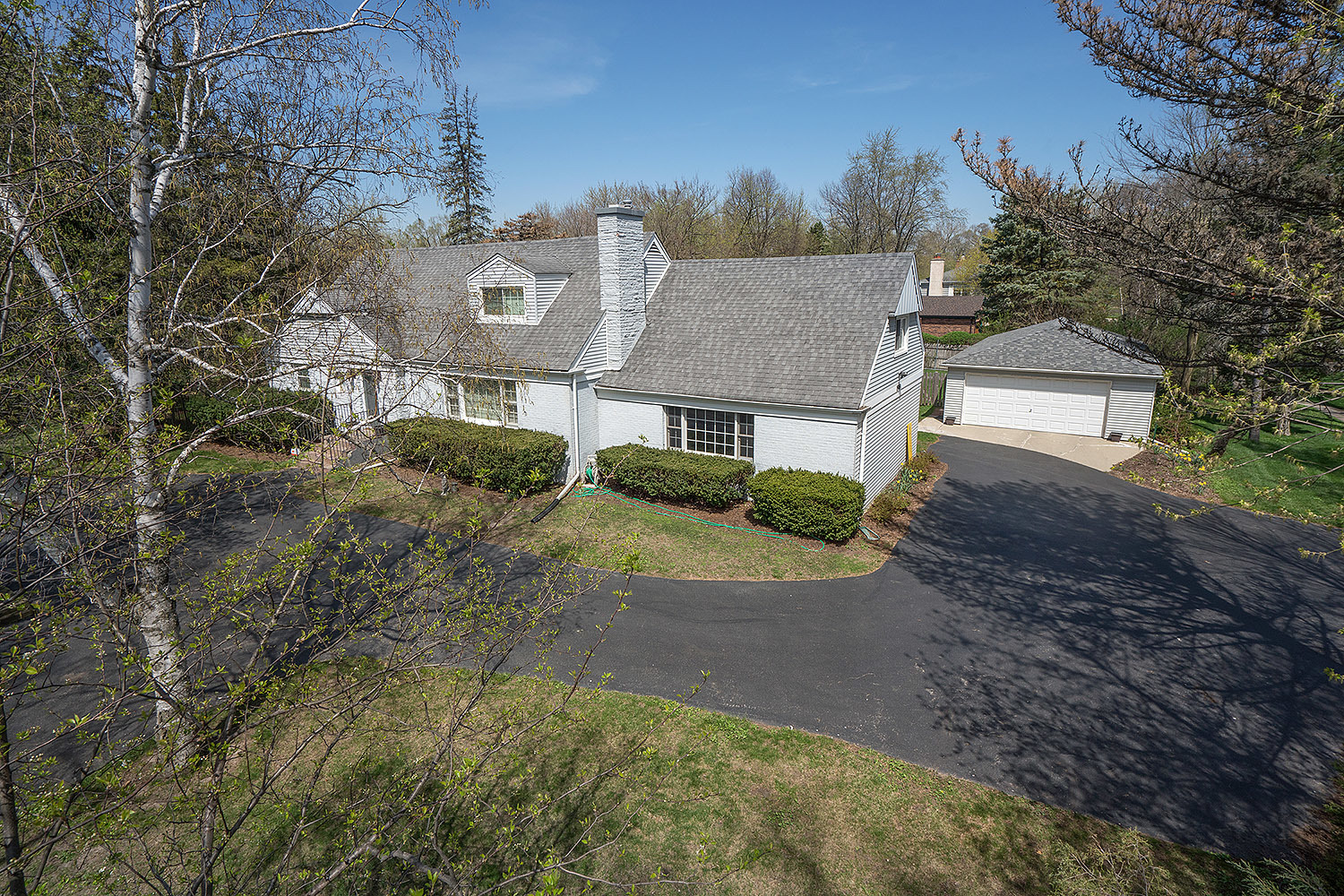 3220 Techny Road Northbrook, IL 60062 - Photo 2 of 37 a front view of a house with a yard and garage