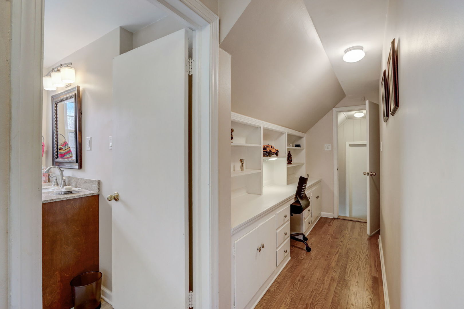 3220 Techny Road Northbrook, IL 60062 - Photo 21 of 37 a hallway with white cabinets and wooden floor