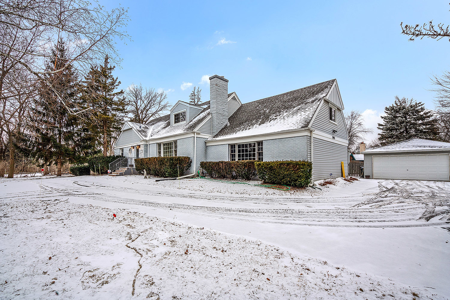3220 Techny Road Northbrook, IL 60062 - Photo 32 of 37 a front view of a house with a dirt yard and a large tree