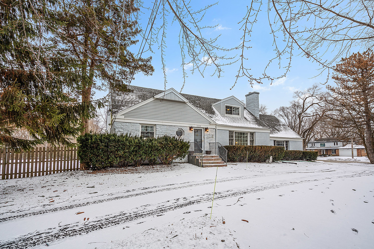 3220 Techny Road Northbrook, IL 60062 - Photo 33 of 37 a front view of a house with a yard covered in snow