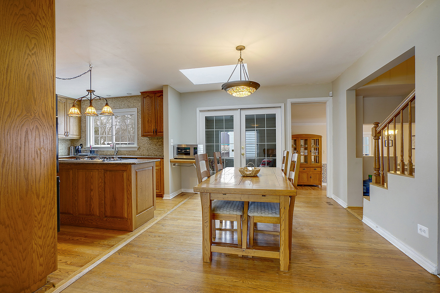 3220 Techny Road Northbrook, IL 60062 - Photo 6 of 37 a kitchen with a dining table chairs and refrigerator