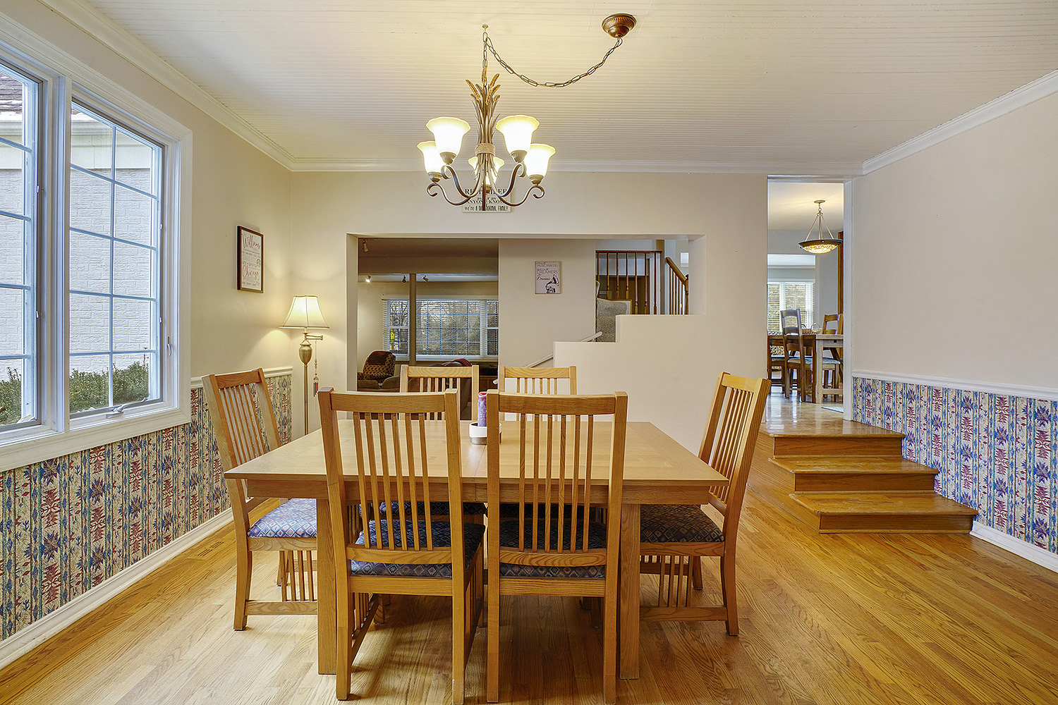 3220 Techny Road Northbrook, IL 60062 - Photo 8 of 37 a view of a dining room with furniture a chandelier and wooden floor