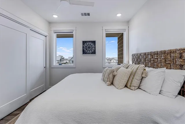 a view of a city from a dining room with furniture
