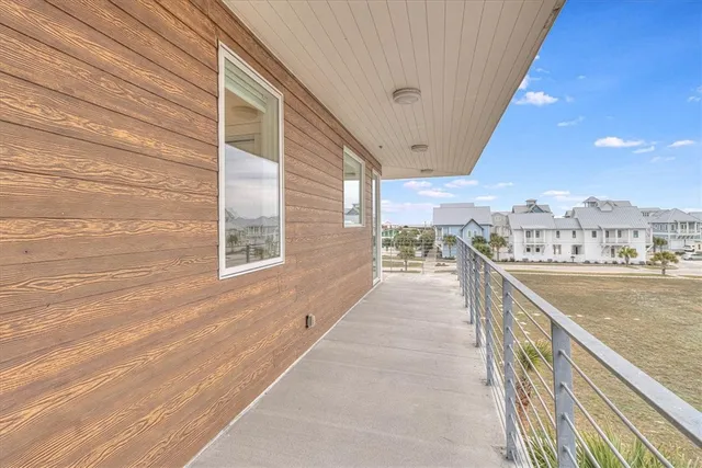 a view of a terrace with furniture and city view