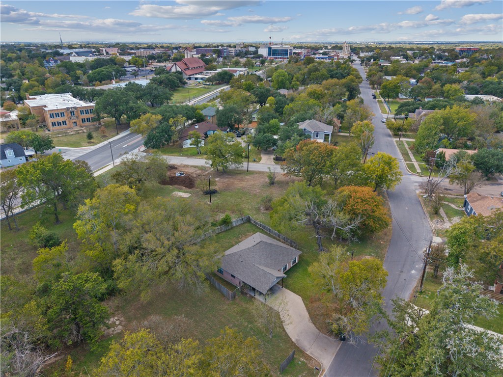 1003 East 24th Street Bryan, TX 77803 - Photo 19 of 24 Aerial overview of property's location with a tree filled landscape
