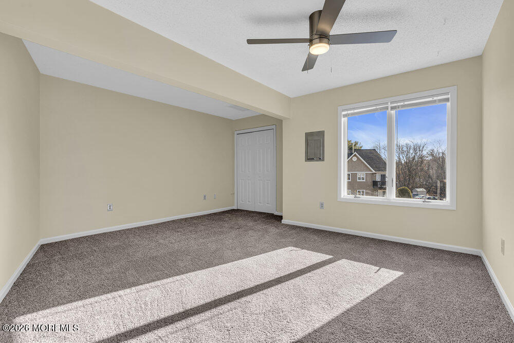 290 North Main Street, Unit C4 Barnegat, NJ 08005 - Photo 8 of 12 a view of an empty room with a window
