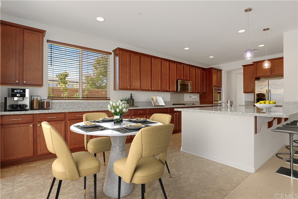 29309 First Green Lake Elsinore, CA 92530 - Photo 12 of 59 a kitchen with a dining table chairs and microwave