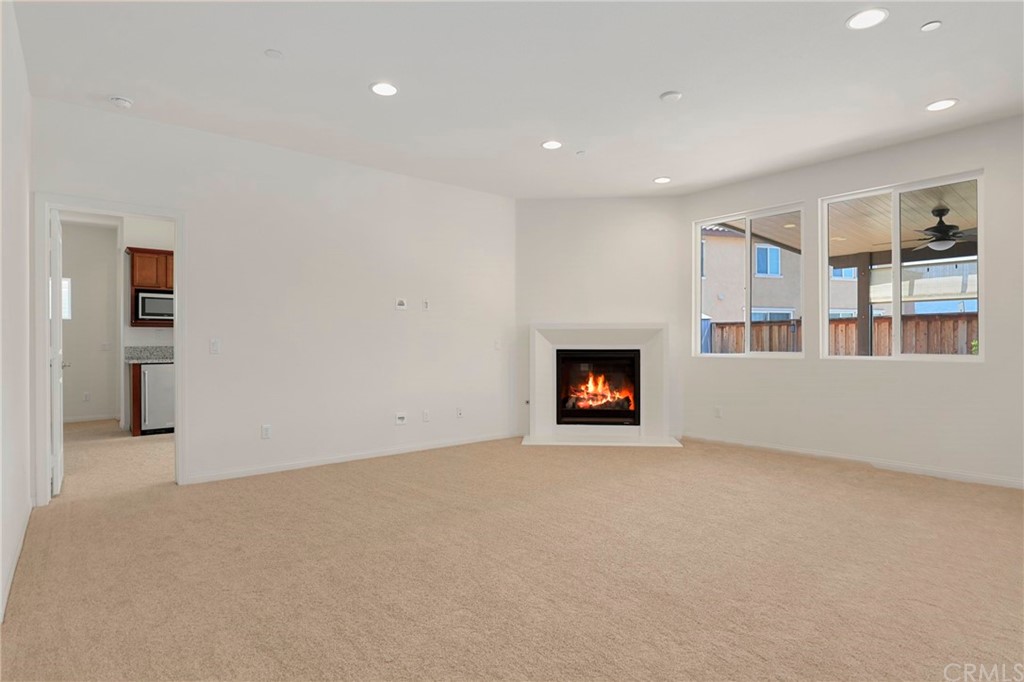29309 First Green Lake Elsinore, CA 92530 - Photo 13 of 59 a view of an empty room with a fireplace