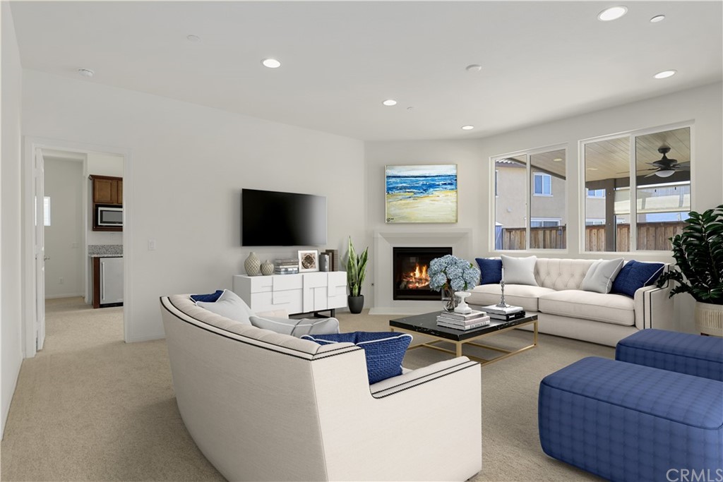 29309 First Green Lake Elsinore, CA 92530 - Photo 14 of 59 a living room with furniture and a flat screen tv