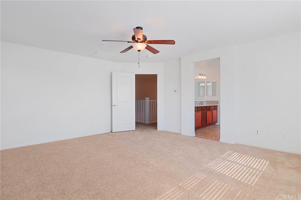 29309 First Green Lake Elsinore, CA 92530 - Photo 39 of 59 a view of a room with a ceiling fan and entryway