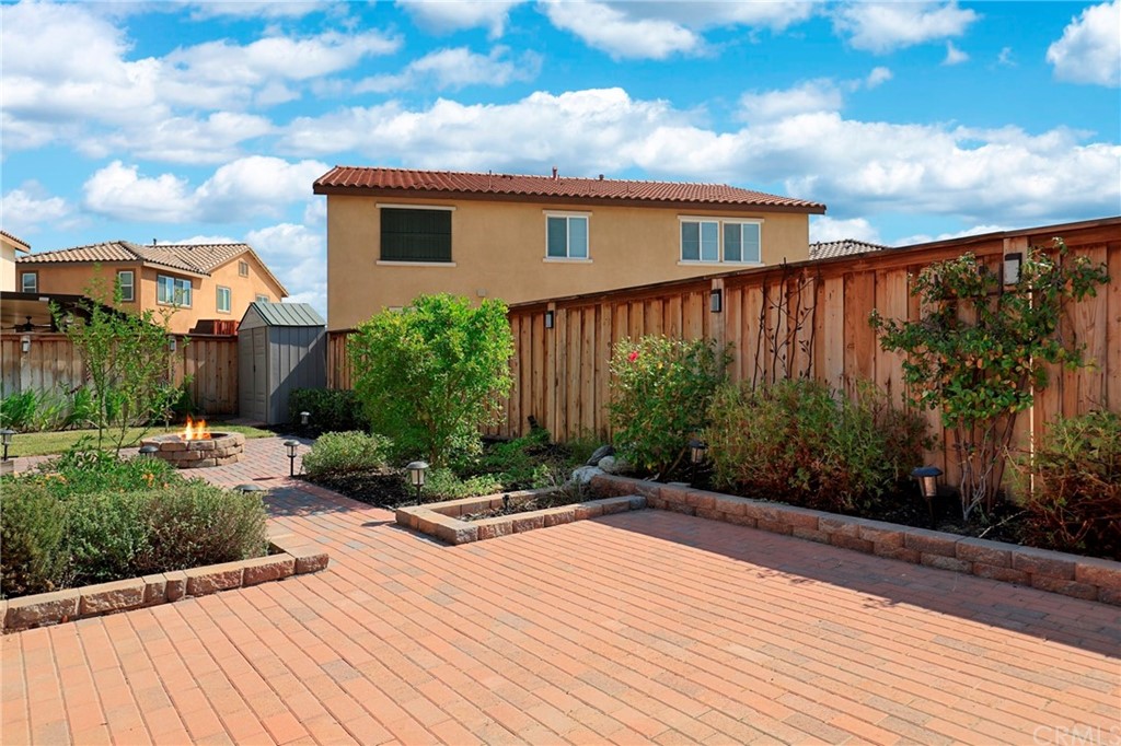 29309 First Green Lake Elsinore, CA 92530 - Photo 44 of 59 a backyard of a house with lots of green space