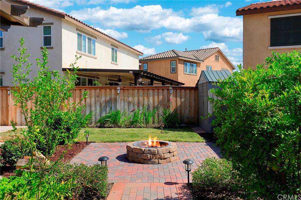 29309 First Green Lake Elsinore, CA 92530 - Photo 46 of 59 a view of a house with backyard and garden
