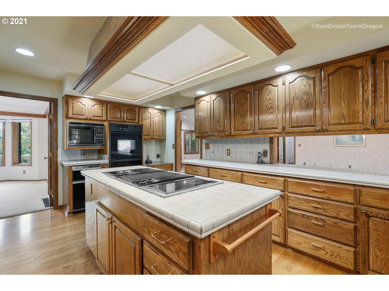 16361 Southeast Bartel Road Boring, OR 97009 - Photo 8 of 32 a kitchen with a stove a sink a refrigerator and a microwave