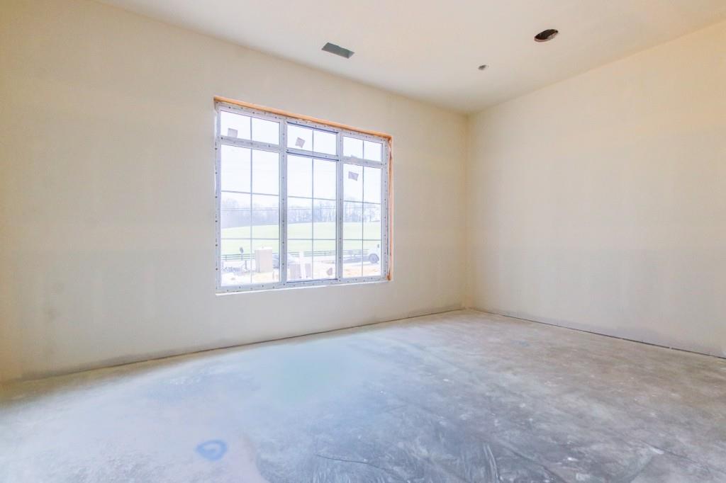4317 Sugar Pike Road Canton, GA 30115 - Photo 19 of 42 an empty room with a window