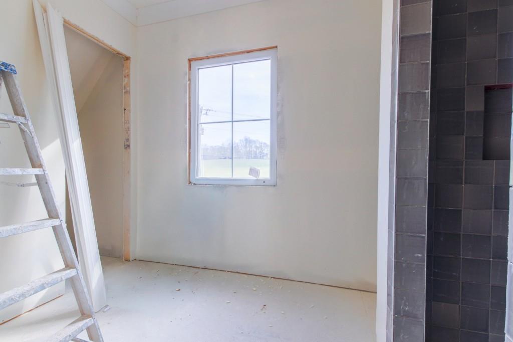 4317 Sugar Pike Road Canton, GA 30115 - Photo 33 of 42 an empty room with windows