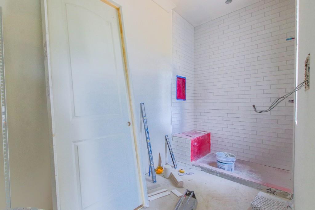 4317 Sugar Pike Road Canton, GA 30115 - Photo 36 of 42 a bathroom with a sink and a shower