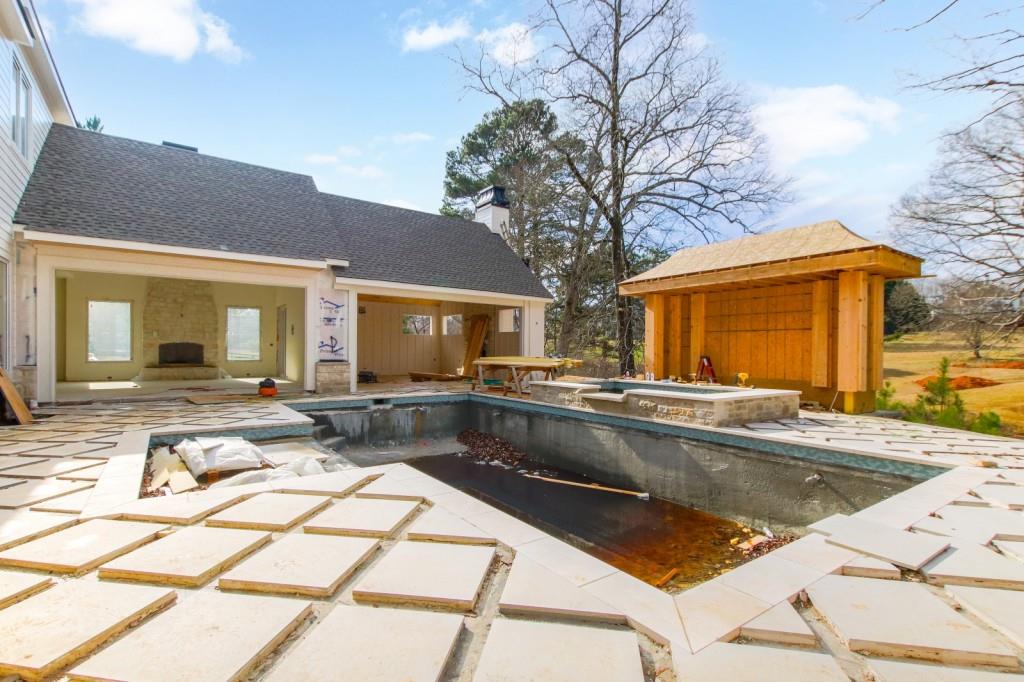 4317 Sugar Pike Road Canton, GA 30115 - Photo 41 of 42 a view of a house with swimming pool and sitting area