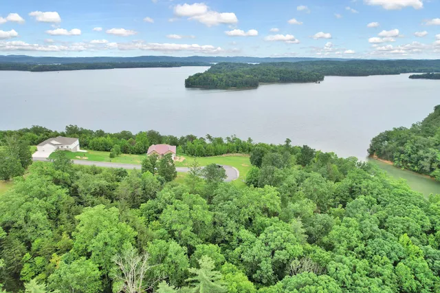 a view of a lake with a yard