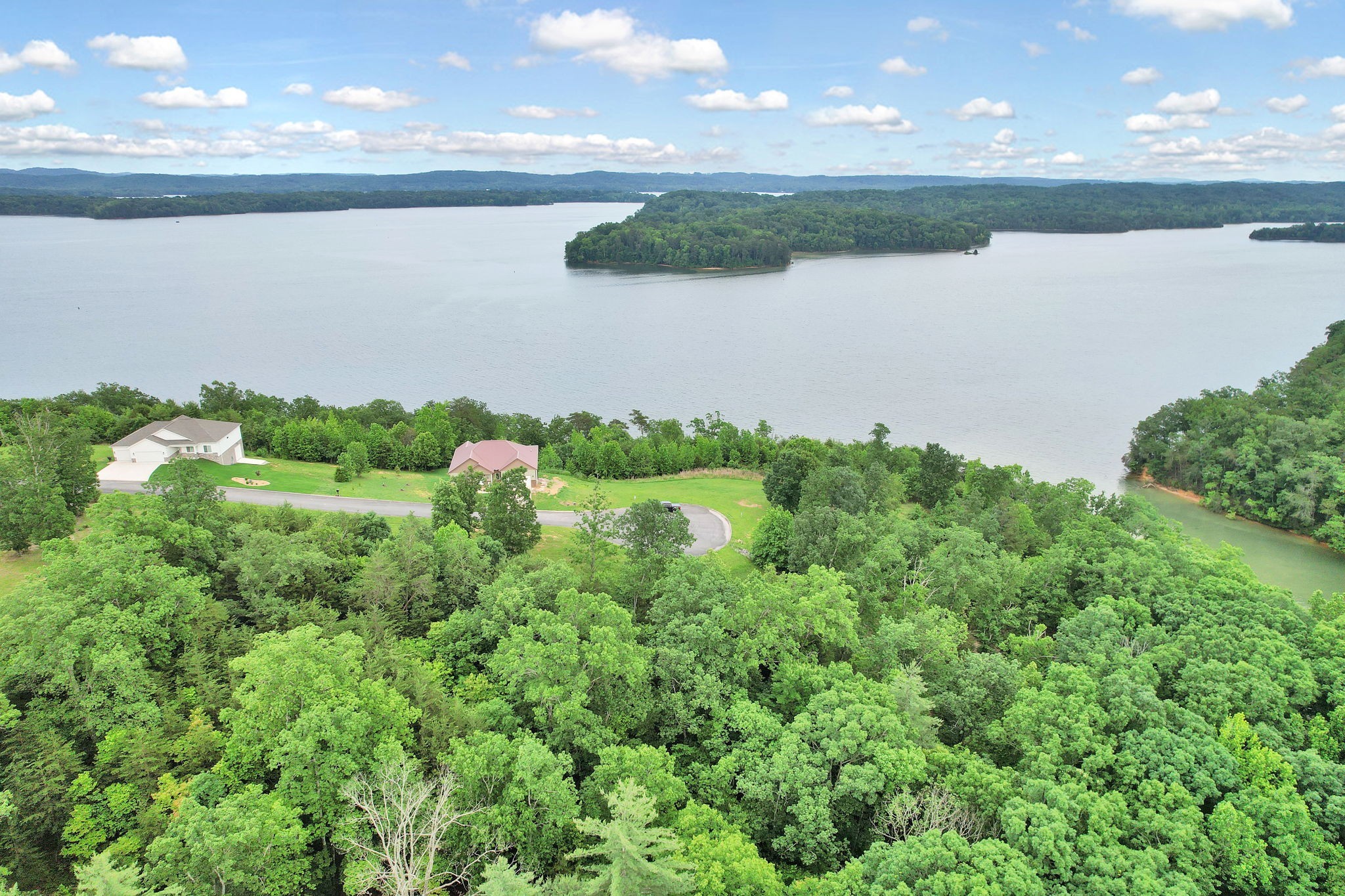 a view of a lake with a yard