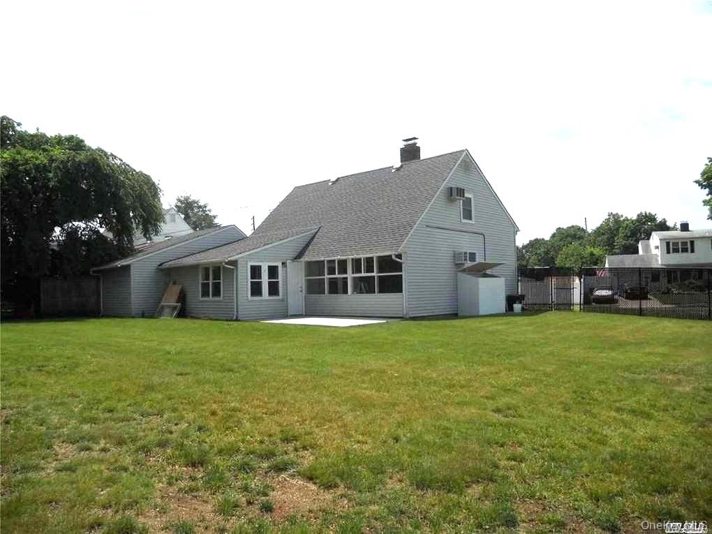 154 Kingfisher Road Levittown, NY 11756 - Photo 20 of 20 a house view with a garden space
