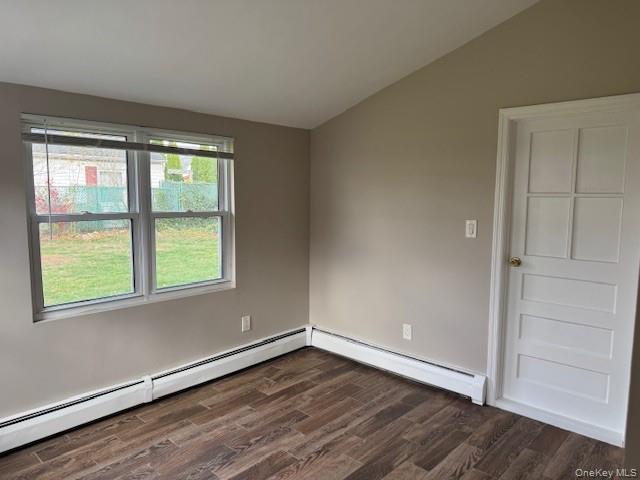 154 Kingfisher Road Levittown, NY 11756 - Photo 6 of 20 an empty room with wooden floor and windows