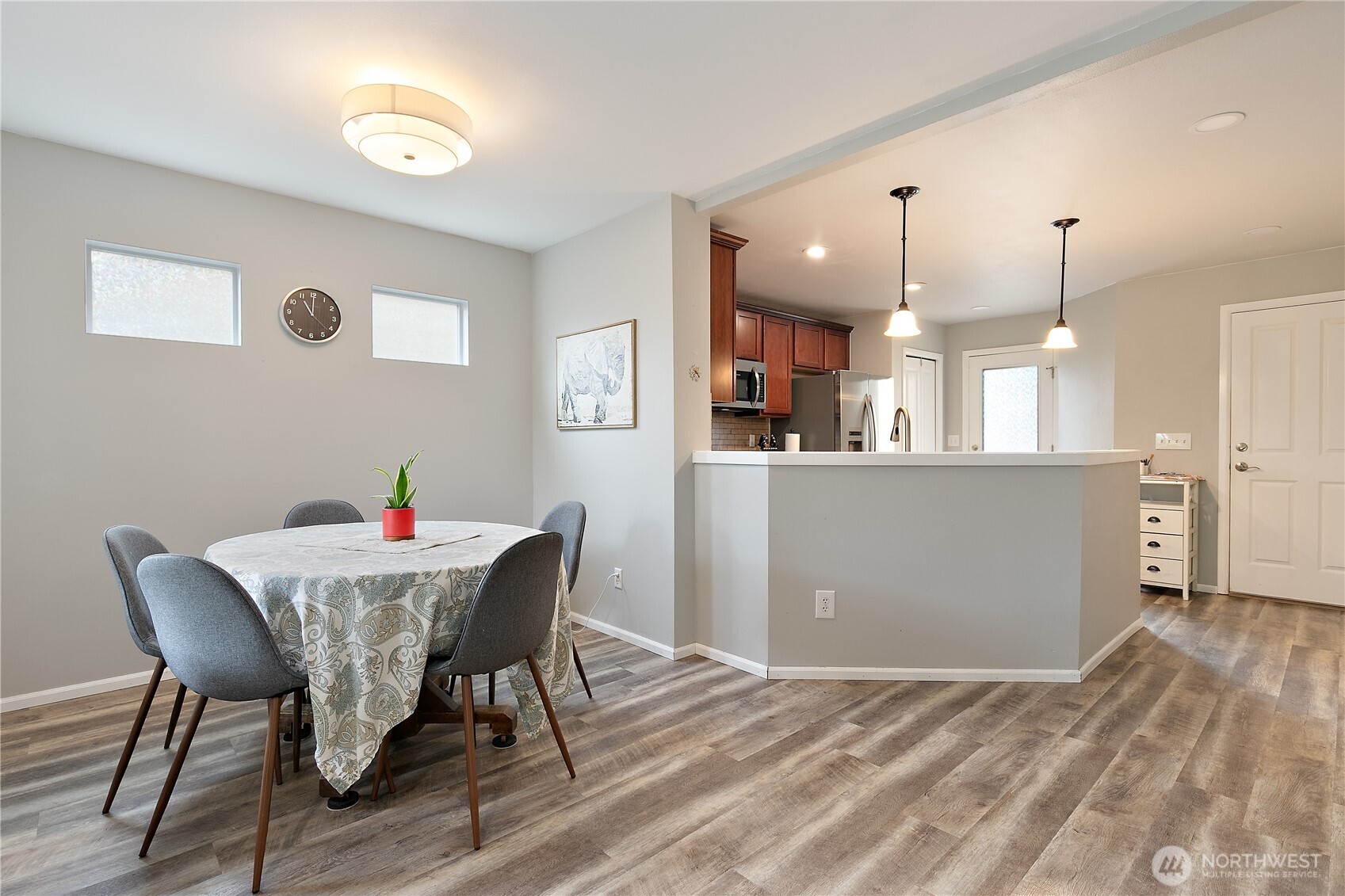 6600 Indiana Street Southeast Lacey, WA 98513 - Photo 7 of 21 a view of a dining room with furniture and wooden floor