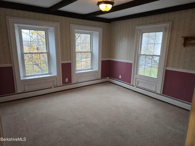 an empty room with windows