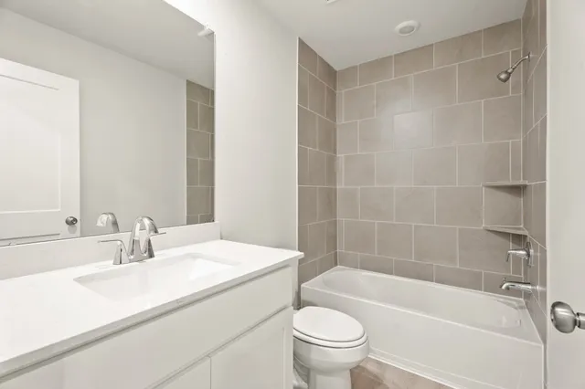 a bathroom with a sink toilet and bathtub