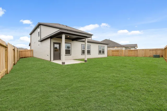 a picture of a bathroom with a refrigerator