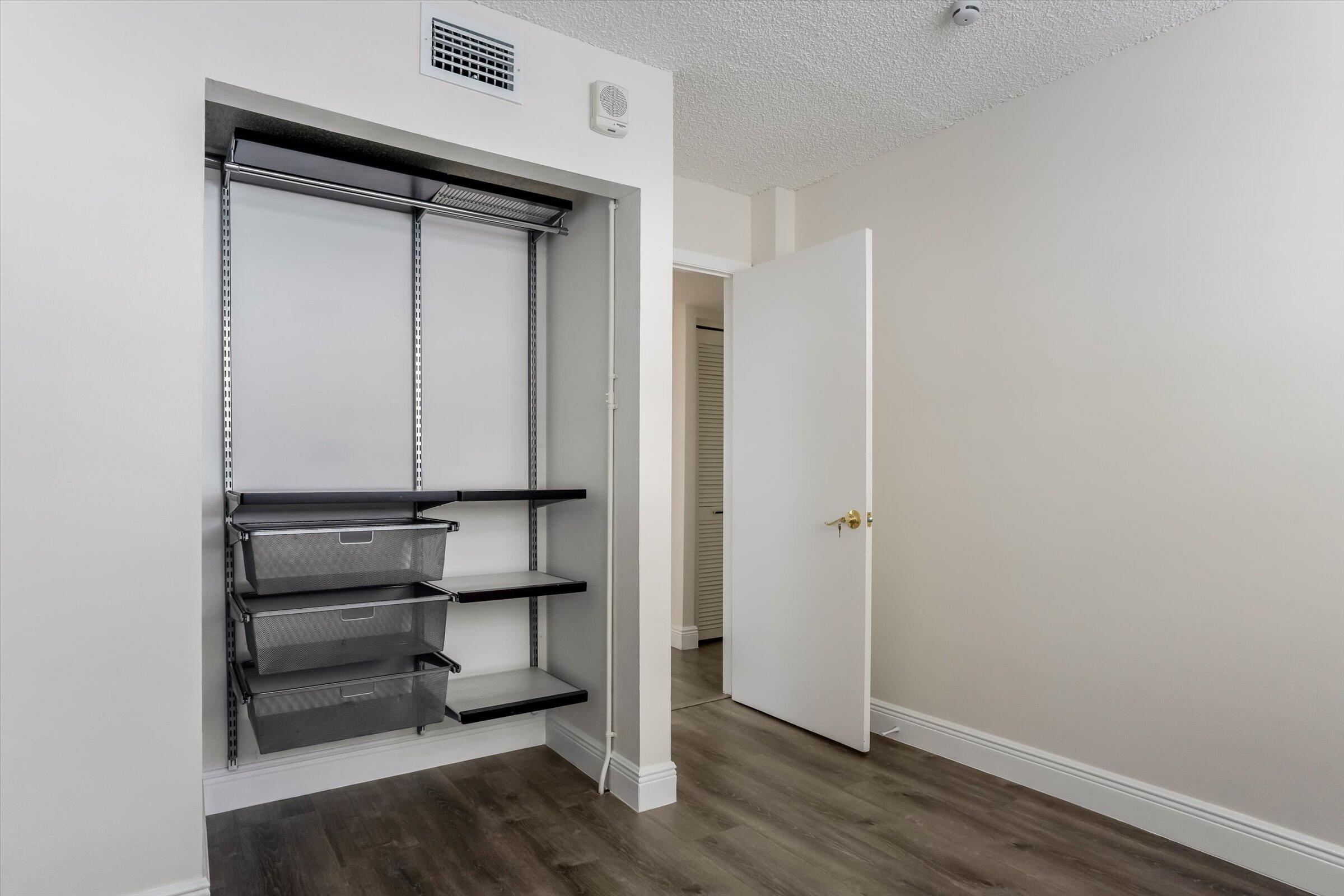 1673 Bay Road, Unit 206 Miami Beach, FL 33139 - Photo 13 of 19 a view of an empty walk in closet