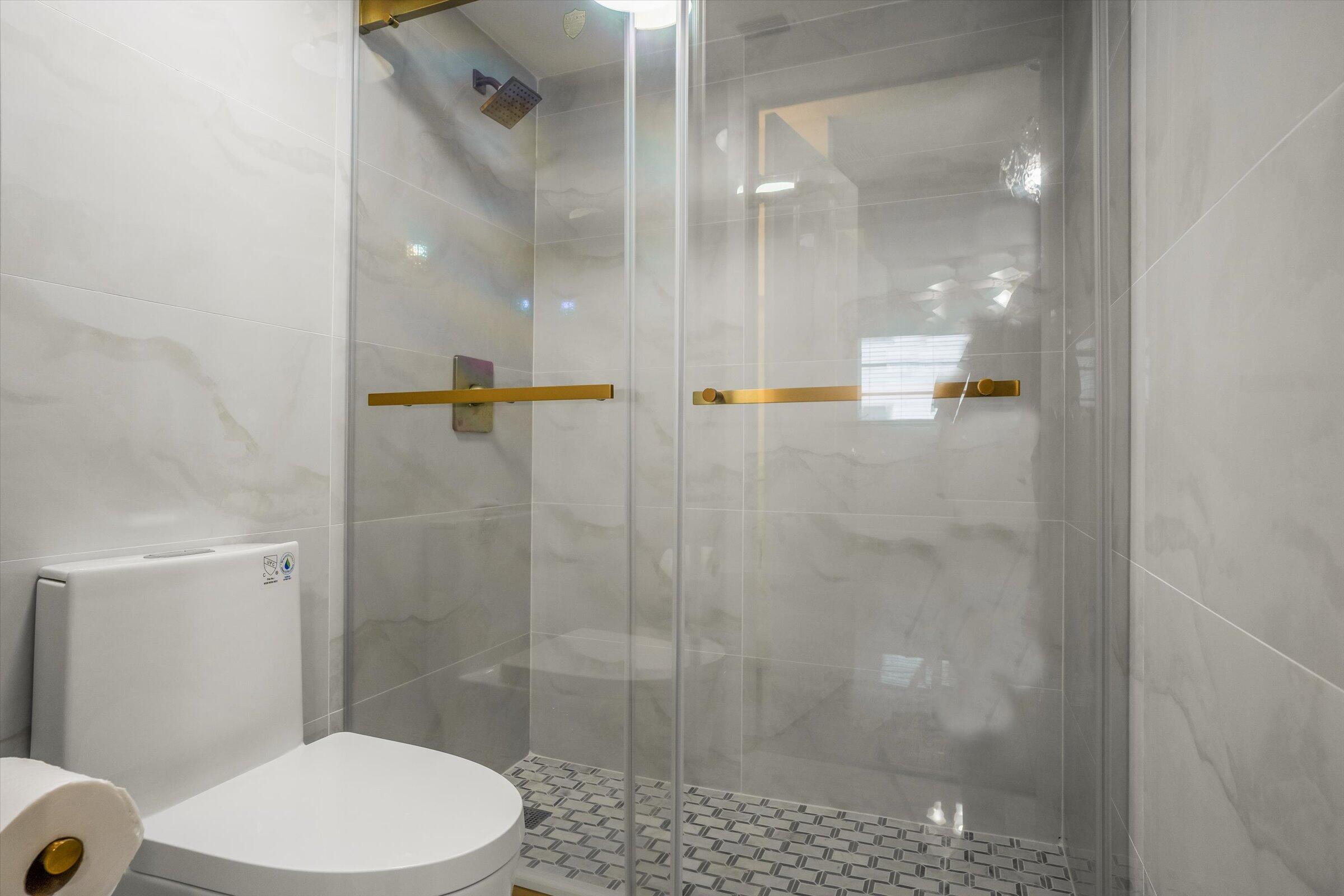 1673 Bay Road, Unit 206 Miami Beach, FL 33139 - Photo 19 of 19 a bathroom with a shower and a toilet