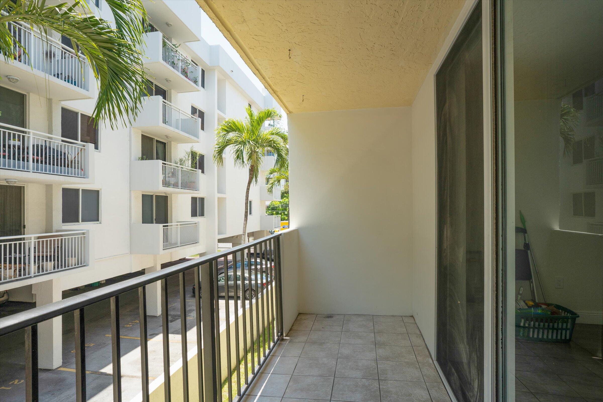 1673 Bay Road, Unit 206 Miami Beach, FL 33139 - Photo 10 of 19 a view of a building from a balcony
