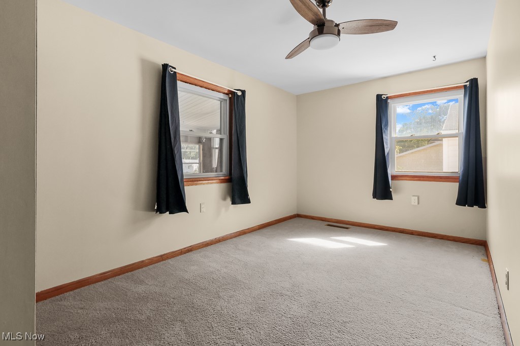 1702 Far View Road Akron, OH 44312 - Photo 17 of 49 Carpeted bedroom featuring ceiling fan and baseboards