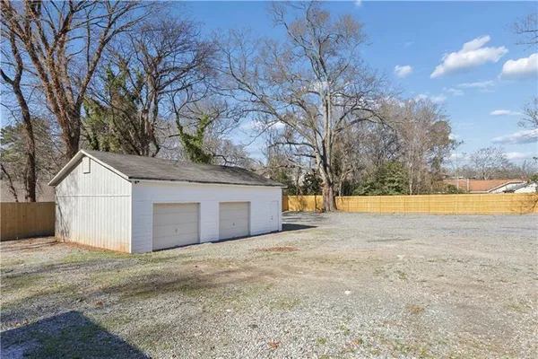 a view of house with a yard