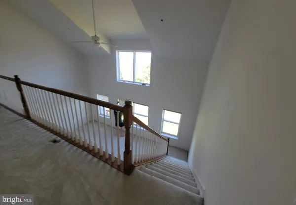 a view of a hallway with windows