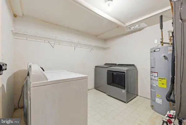a view of a room with a floor to ceiling window and entryway