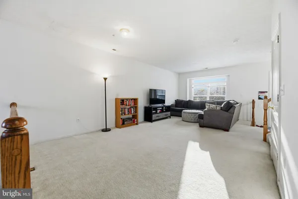 a large bedroom with furniture